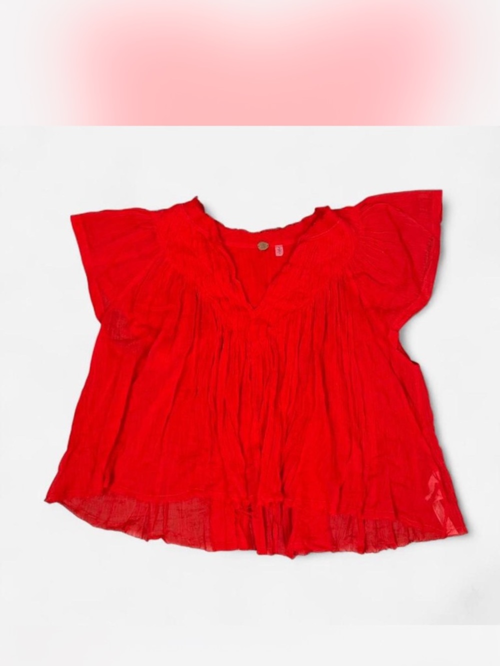 Free People Red babydoll blouse with ruffles.